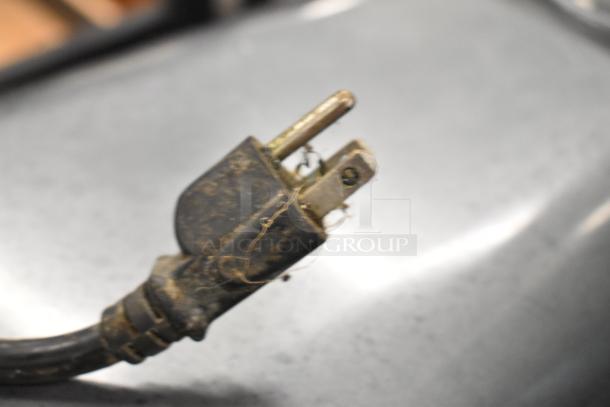 Close-up of a power plug for Avantco MX30 mixer, showing signs of wear and dust.