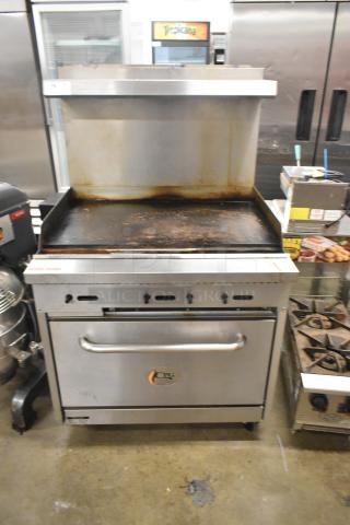 Commercial griddle with oven, backsplash, and overshelf by Cooking Performance Group, model 351S36G36N. 120,000 BTU.