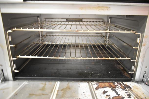 Cooking Performance Group CPG 351S36G36N griddle with oven, stainless steel, natural gas, 120,000 BTU, visible interior racks.