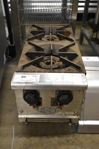 L&J stainless steel commercial 2-burner gas range, countertop model, with visible wear and rust. Control knobs intact.