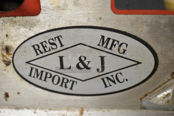 L&J stainless steel gas countertop 2 burner range. Shows L&J logo on metal surface, indicating maker's brand.
