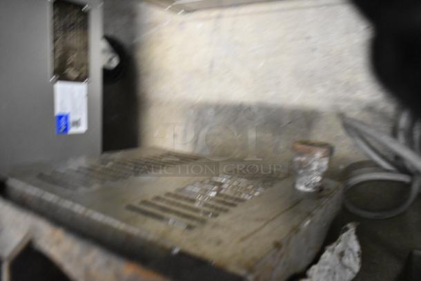 L&J stainless steel 2-burner gas range, commercial countertop model, used condition, visible wear on surface.