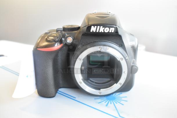 Three Nikon D3500 camera bodies, one with Nikon AF-P Nikkor 18-55mm lens; camera bodies shown in good condition.