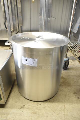 Brand new aluminum stock pot with lid, 471SPC60, 16 15/16" diameter. Scratch and dent condition. Auction label shows item 84.