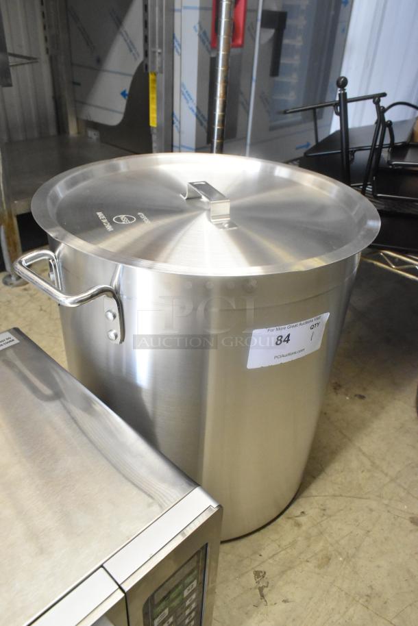 Brand new scratch and dent aluminum stock pot with 471SPC60 Choice 16 15/16" pan cover, slight exterior blemishes.