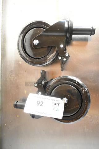 Lot of 2 brand new commercial casters with minor scratches. Black, sturdy design, labeled "QTY x2."