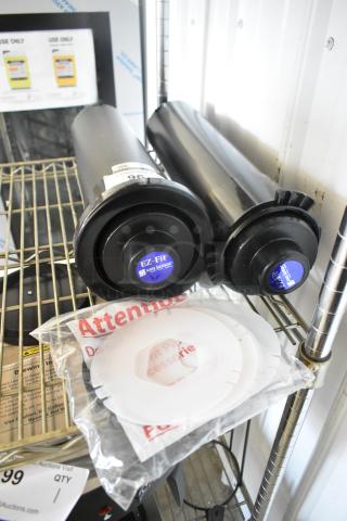 Two brand new San Jamar C2210 EZ Fit cup dispensers. Includes labels and fitting accessories. Slight scratch and dent.