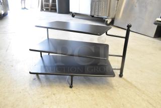 Brand new 3-tier rack with minor scratches; sturdy black metal and sleek design for efficient storage.