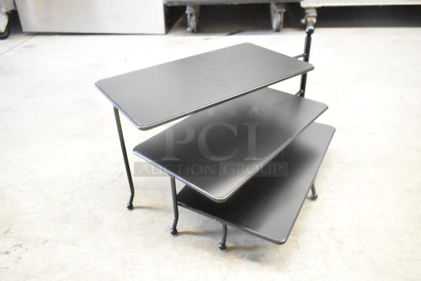 Black 3-tier metal rack, modern design, scratch and dent condition, new, sturdy construction, ideal for storage.