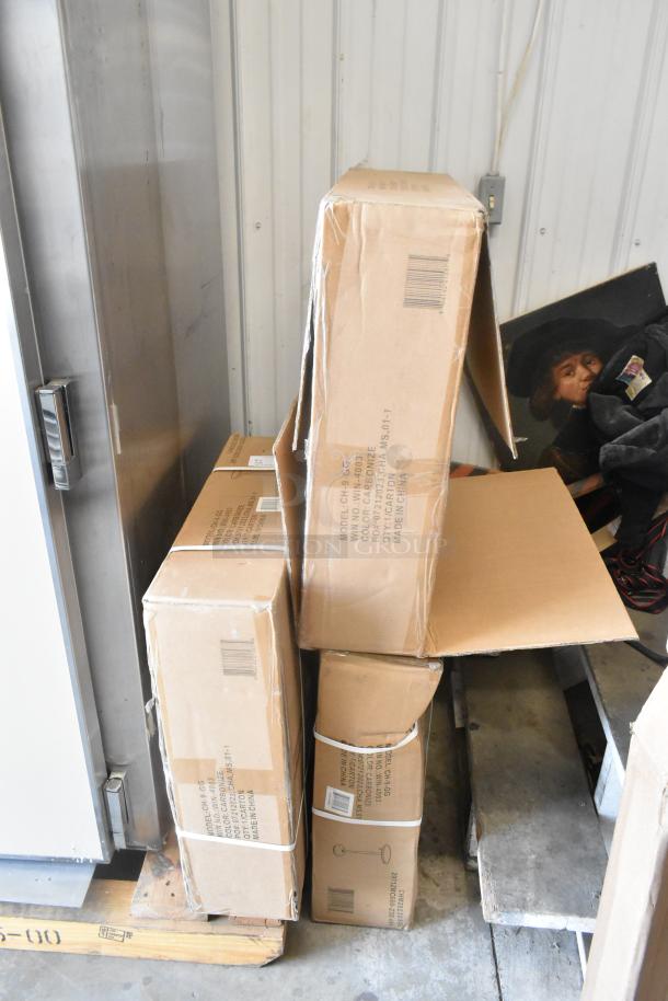 Three CH-6-GG tables in boxes, marked "scratch and dent," stacked on a pallet. Boxes show minor wear.
