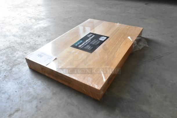 Alt text: Brand new Choice wood cutting board, 18"x12"x1.75", with squared edges, in original packaging, minor scratches.