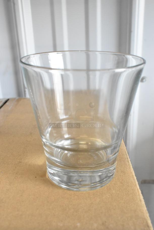 Bormioli Rocco Bodega Maxi Tumbler 17.25 oz glass, clear, on a cardboard surface. New, slight scratches visible.