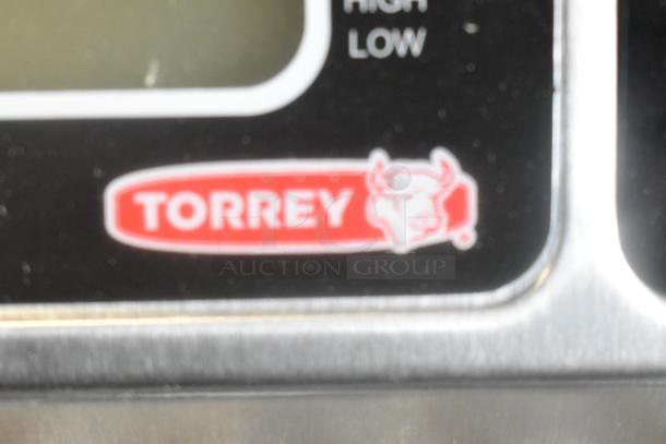 Torrey L-EQ 10/20 scale logo close-up, showing red bull logo, model legal for trade, 20 lb. capacity, scratch and dent condition.