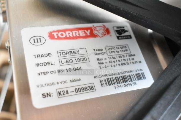 Brand new Torrey L-EQ 10/20 digital scale, 20 lb. capacity, legal for trade. Label shows model and serial number.