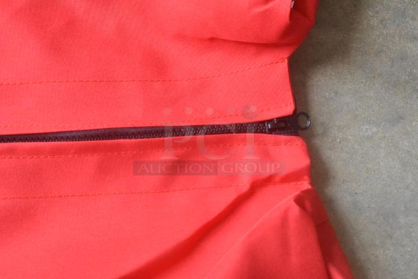 Red bag with zipper, brand new condition. Minor scratch and dent as indicated. Appealing bright color, sturdy fabric.