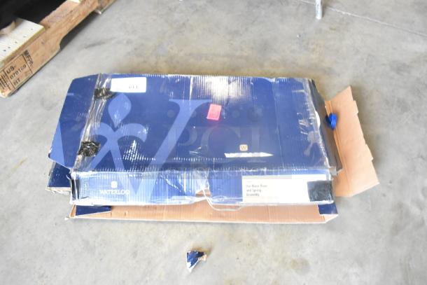 Brand new Waterloo 750PRAXF pre-rinse assembly with riser, hose, and spray valve in original but damaged packaging.