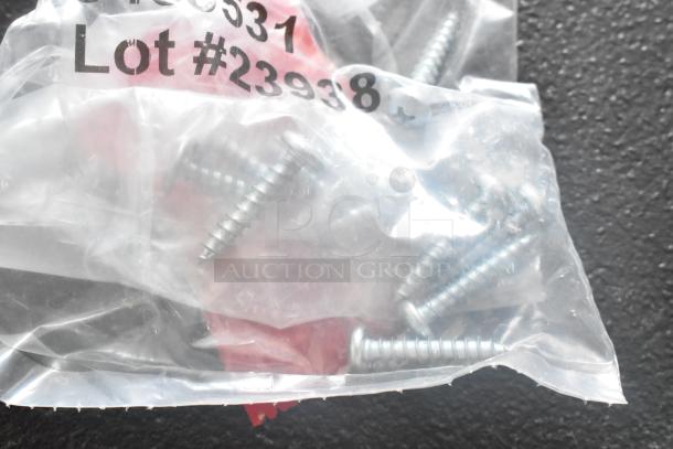 Bag of screws for Suncast shelf kit, labeled "Lot #23938," part of new scratch and dent vertical shed kit set.