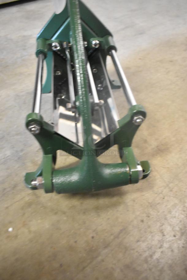 Brand new Garde metal vegetable cutter, slight scratch and dent. Green frame with stainless steel blades.