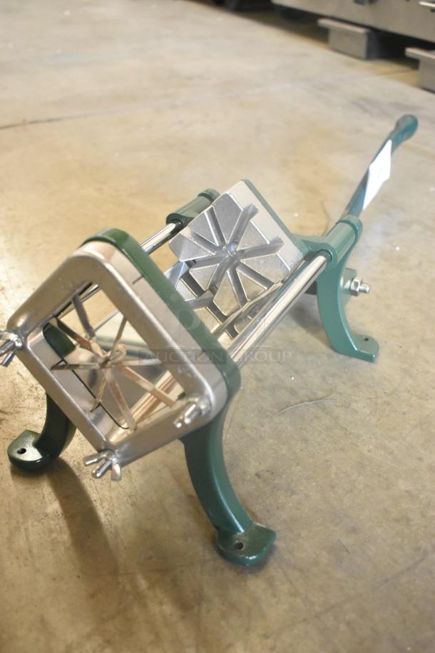 Brand new Garde metal vegetable cutter, scratch and dent condition, featuring stainless steel blades and green support legs.