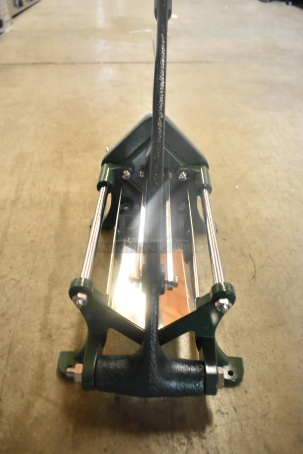Brand new Garde metal vegetable cutter. Heavy-duty design, slight scratches and dents visible. Sturdy construction.