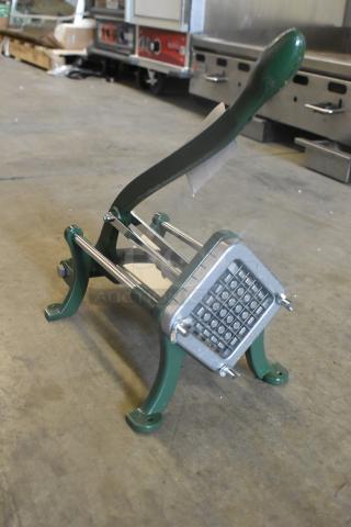 Brand new Garde metal vegetable cutter, scratch and dent condition, green frame, sturdy design, ideal for slicing.