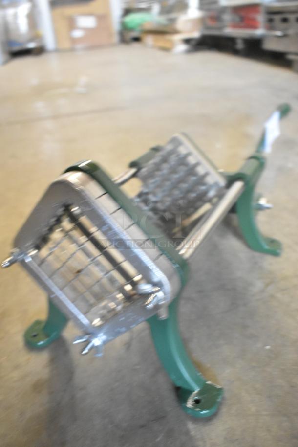 Brand new Garde metal vegetable cutter, scratch and dent condition, sturdy green and metal construction, ideal for kitchen use.