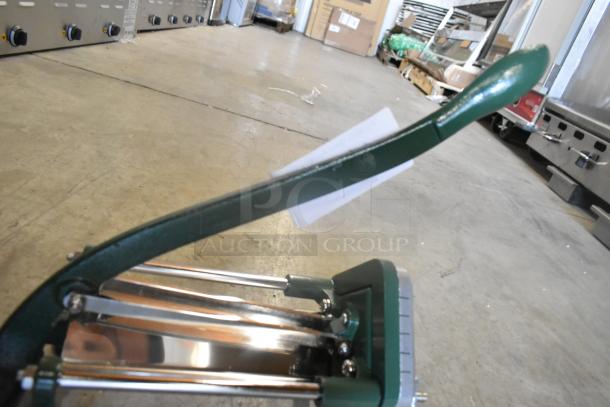 BRAND NEW Garde Metal Vegetable Cutter with minor scratches, green handle, and sharp stainless steel blades.