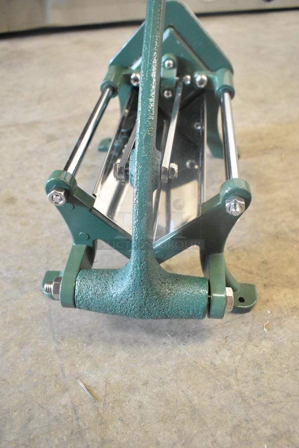 Brand new Garde metal vegetable cutter, scratch and dent condition, green with metal components, durable construction.