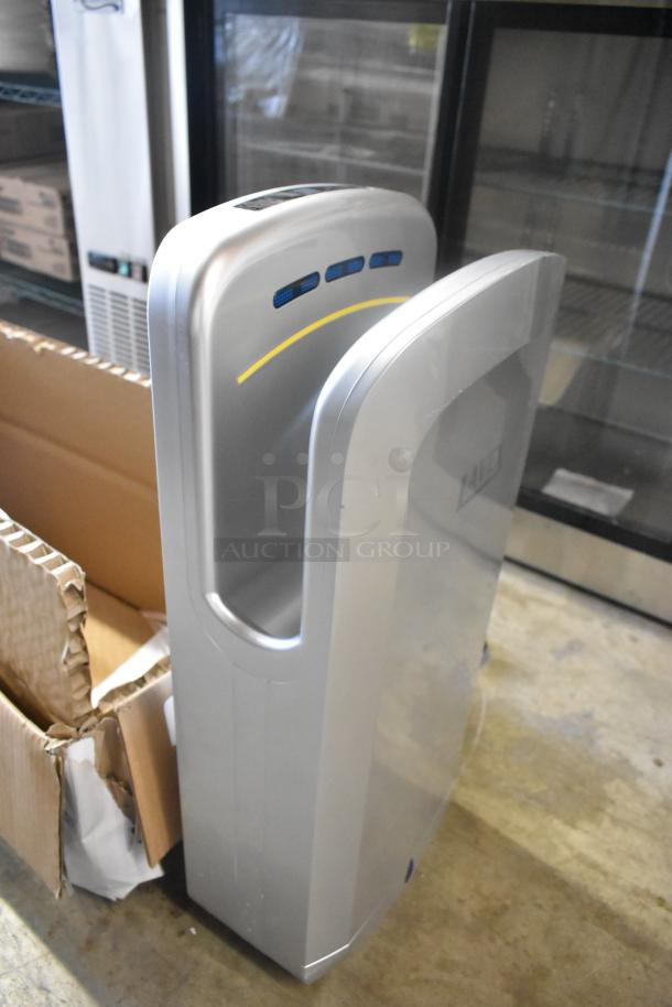 Lavex silver ABS plastic automatic vertical hand dryer, brand new with scratches, features HEPA filtration, 110/120V.