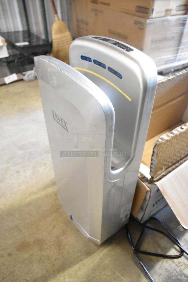 BRAND NEW Lavex Silver ABS Plastic Automatic Vertical Hand Dryer with HEPA Filtration, 110/120V, 1 Phase. Minor scratches.