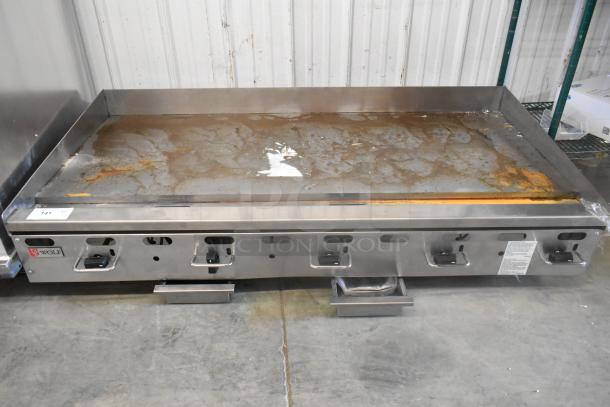 Wolf AGM60-101 stainless steel countertop griddle, 135,000 BTU natural gas, lightly used, with visible controls and Wolf logo.