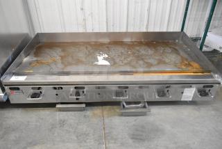 Wolf AGM60-101 stainless steel countertop griddle, 135,000 BTU natural gas, lightly used, with visible controls and Wolf logo.