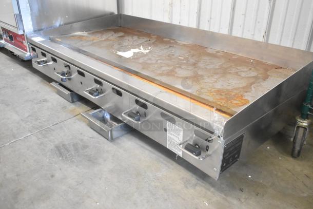 Wolf AGM60-101 stainless steel flat top griddle, natural gas, 135,000 BTU, commercial grade, visible cosmetic wear.