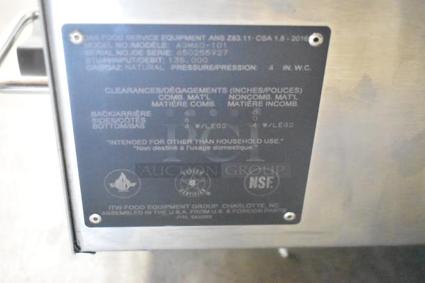 Wolf AGM60-101 stainless steel commercial griddle, natural gas, 135,000 BTU, model plaque visible, NSF certified.
