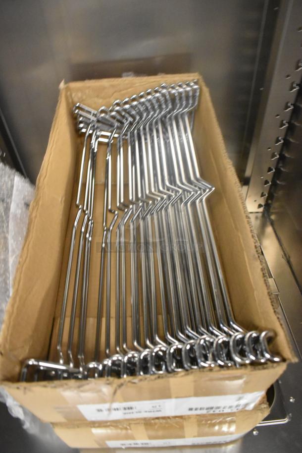 Box of metal hooks, likely for shelving, inside the 2025 Metro C519-PFC-U proofing cabinet. Hooks unwrapped, new condition.