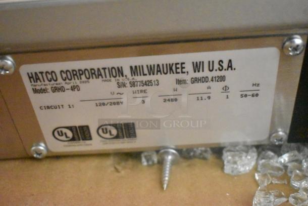 "Hatco GRHD-4PD label indicating model, serial number, voltage, and UL certification, on stainless steel merchandiser."