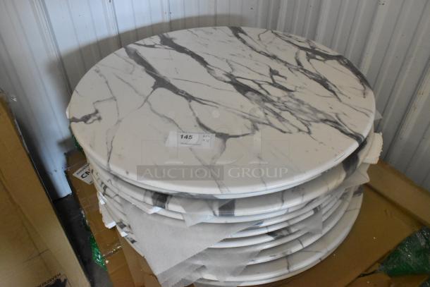 Stack of round marble pattern tabletops, brand new with minor scratches. Includes 11 pieces. Tag indicates quantity 11.