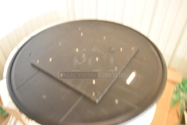 11 scratch and dent items, including a round marble pattern tabletop with slight imperfections, auctioned brand new.