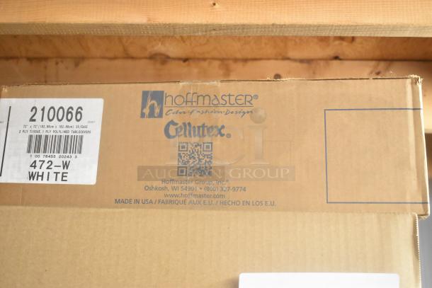 Cardboard box labeled "Hoffmaster" and "Cellutex," containing white 2-ply tissue tablecovers. Barcodes and product info visible.