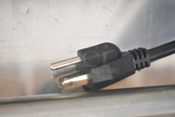 Close-up of a power plug for the 2024 Avantco Modular Full Cube Ice Machine, model 194MCF322A, showing a three-prong design.
