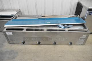 BRAND NEW SCRATCH AND DENT Avantco 177STE4SA stainless steel four-pan open well steam table with undershelf, 120V, 1 phase.