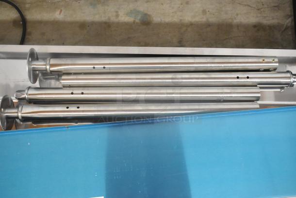 Brand new 2024 Avantco 177STE4SA stainless steel steam table parts, including poles, in original packaging.