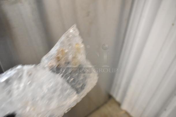 Blurry image of bubble wrap, specific item details not visible.