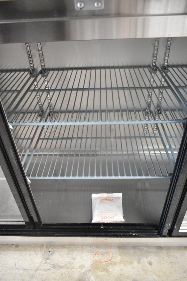 Brand new Avantco 178UBB72SHCS 73" stainless steel back bar refrigerator with sliding glass doors, LED lighting, minor scratches.