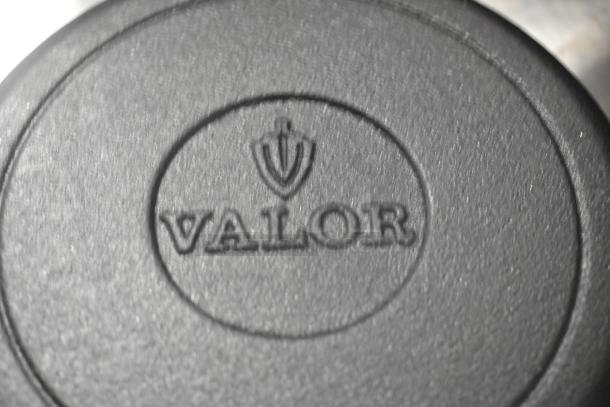 12 Valor cast iron skillets, scratch and dent condition, brand new, embossed with Valor logo, auction lot of 12.