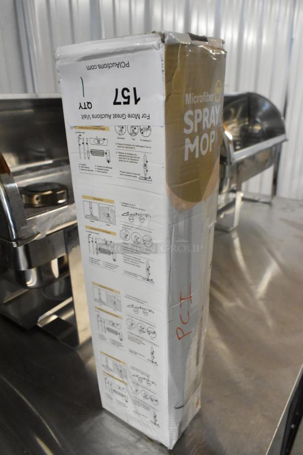 Brand new scratch and dent spray mop in original packaging. Box shows instructions, slight wear, marked with "157" and "PC".