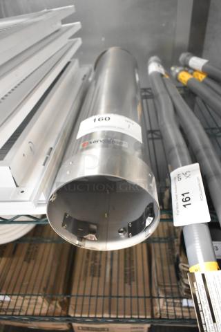 Stainless steel ServSense cup dispenser, brand new with minor scratches and dents. Auction label "160" visible.
