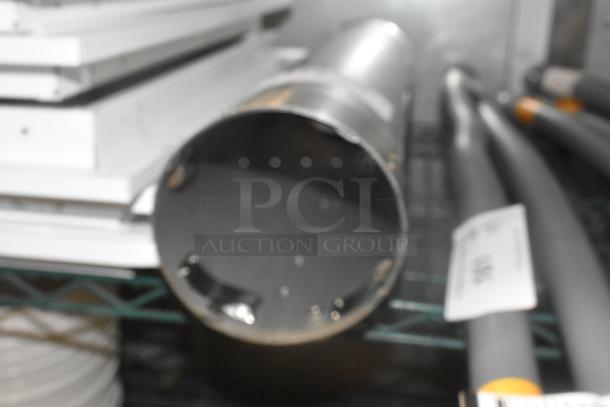 BRAND NEW SCRATCH AND DENT ServSense Stainless Steel Cup Dispenser, visible scuffs, cylindrical shape, metal finish.