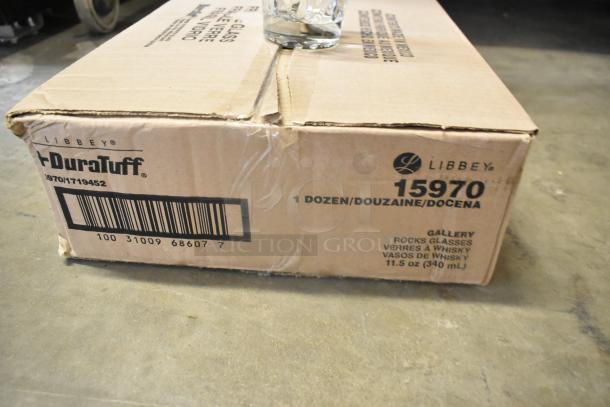 Box of 12 Libbey 15970 Gallery 11.5 oz. stackable rocks glasses, new scratch and dent, visible barcode and label on box.