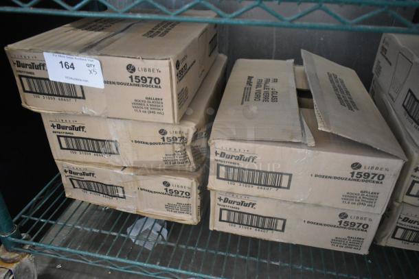 5 boxes of 12 brand new Libbey 15970 Gallery 11.5 oz. stackable rocks glasses, identifiable by labels.